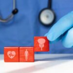 Hidden Fertility Threat Lurks in Grocery Aisles A doctor's gloved hand placing red blocks with health symbols on a table