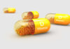 Vitamin D capsules with orange beads inside