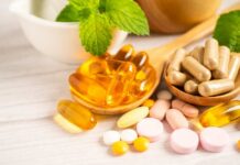 Vitamin Supplements Sabotaging Cancer Treatment? Assorted vitamins and supplements arranged with mint leaves